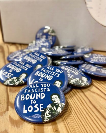 All You Fascists Bound to Lose! Woody Guthrie pin buttons from Ricardo Levins Morales Art Studio