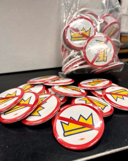 No Kings! Pin button from Ricardo Levins Morales Art Studio.